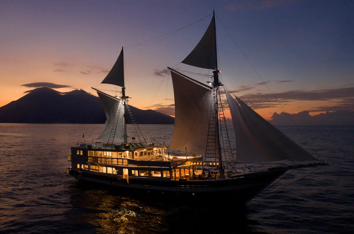 Aliikai Voyage illuminated at sunset in Komodo