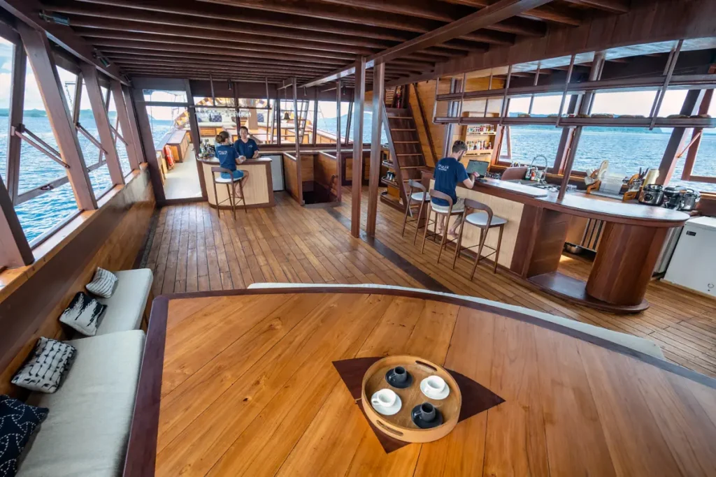 Bar and lounge area aboard a luxury liveaboard in Komodo