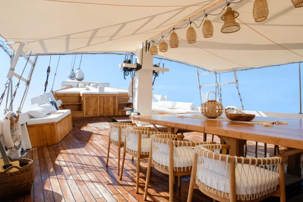 Luxury liveaboard sundeck dining setup at sea