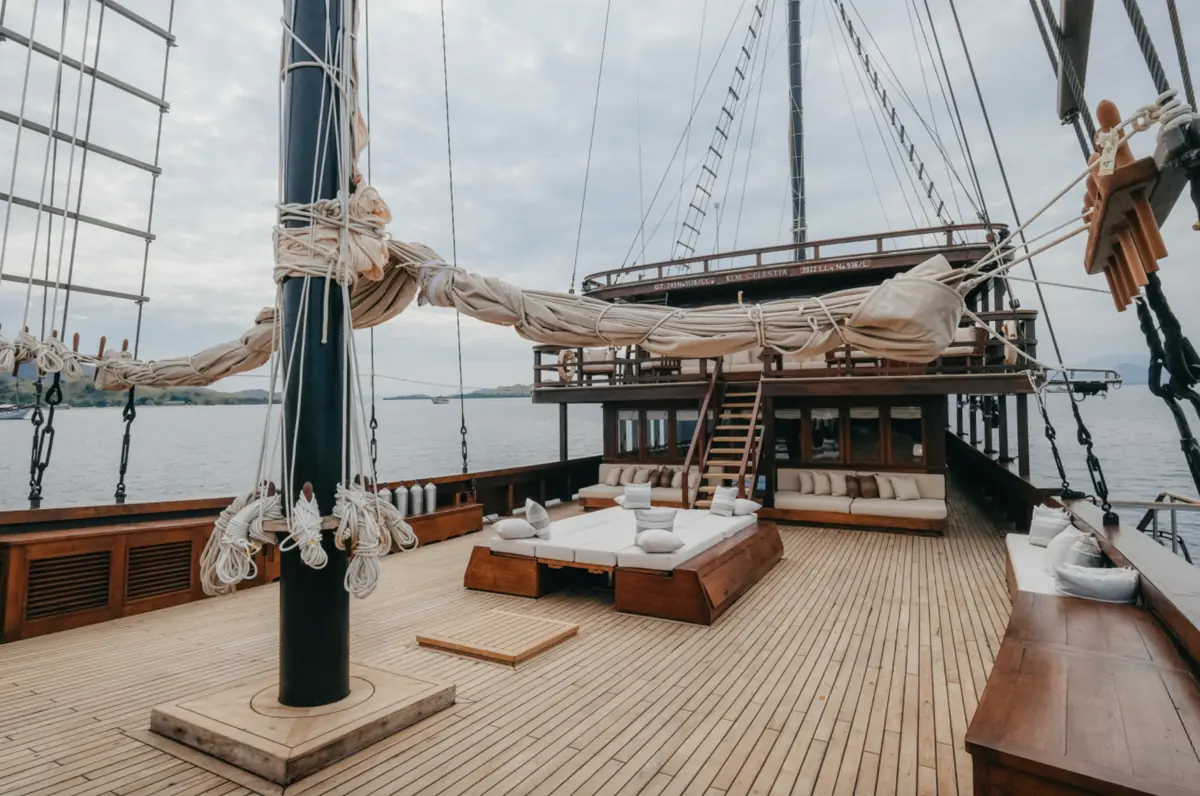 Spacious wooden deck of a luxury Komodo liveaboard