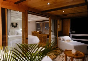 Private suite and outdoor lounge on a phinisi yacht at night