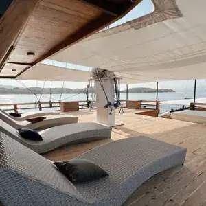 Sundeck lounge chairs on a phinisi yacht in Komodo