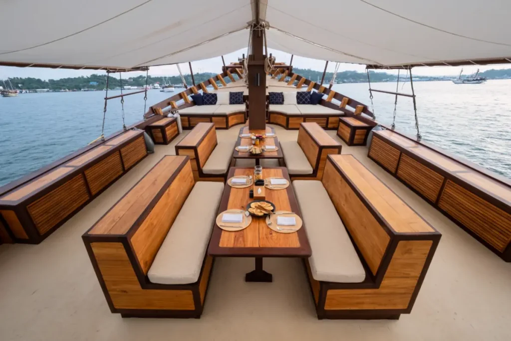 Outdoor dining and lounge deck on Majik yacht