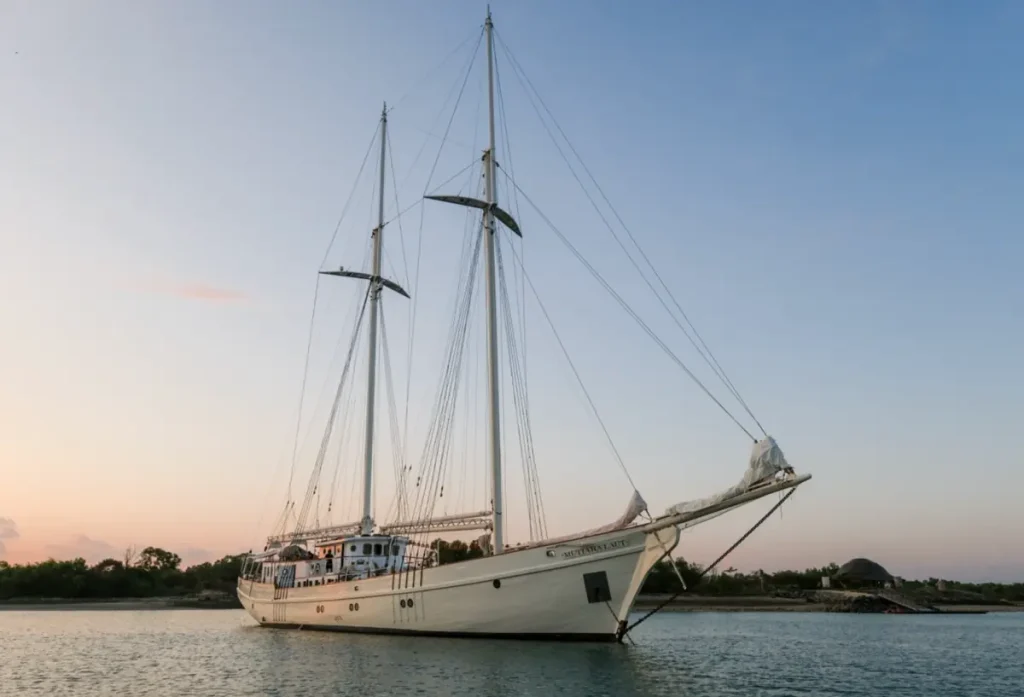 Mutiara Laut anchored at sunset near Komodo